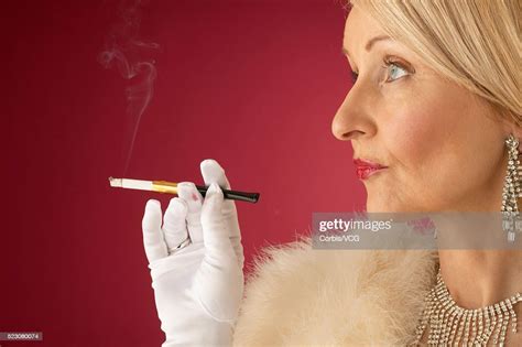 wealthy mature woman smoking cigarette photo getty images