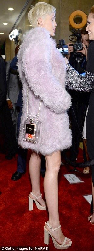 miley cyrus wraps up in lilac fur coat at the pre grammy clive davis