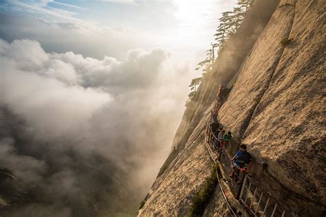 chinas mount hua huashan considered  dangerous hike   world business insider