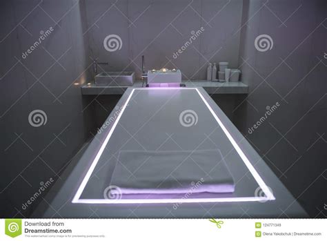 interior of modern spa massage room with dim light stock