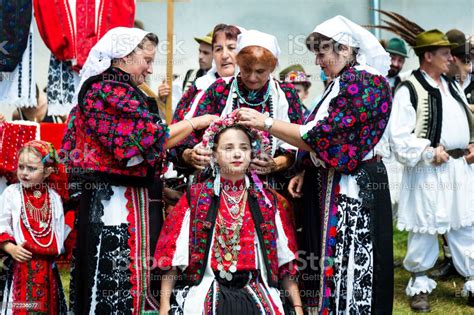 Women Wearing Traditional Romanian Clothing Outdoors In Rural