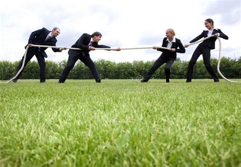 group of people team pulling line playing tug of war stock image image of rivalry people