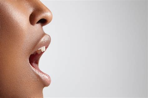Shutterstock 208773370 Profile Of A Black Woman With Open Mouth Image
