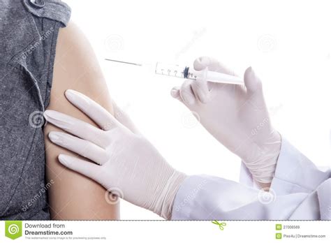 doctor nurse holding a syringe give an injection royalty