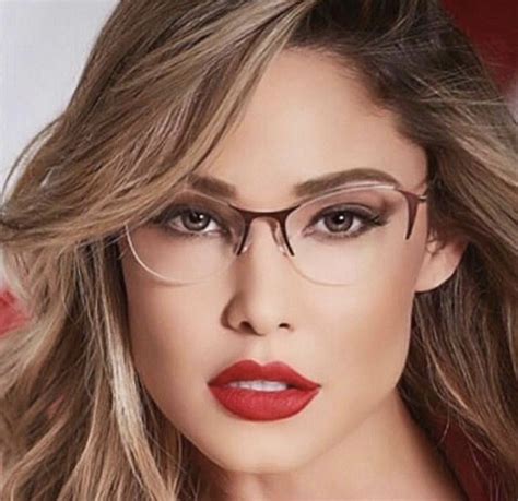 A Woman Wearing Glasses And Red Lipstick