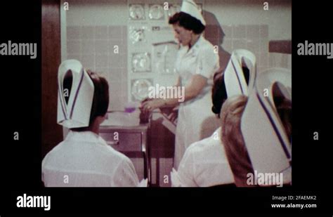 1970s Nurse Examines Infant In Incubator Stock Videos And Footage Hd