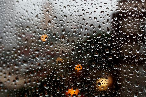 full frame shot  raindrops  glass window  stock photo
