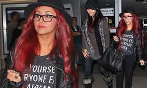 jersey shore star snooki arrives at airport in thick rimmed glasses