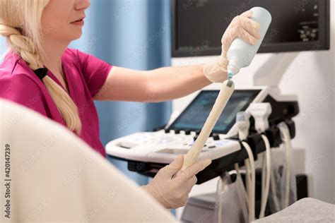 gynecologist applies gel   transvaginal ultrasound scanner   female vaginal examination