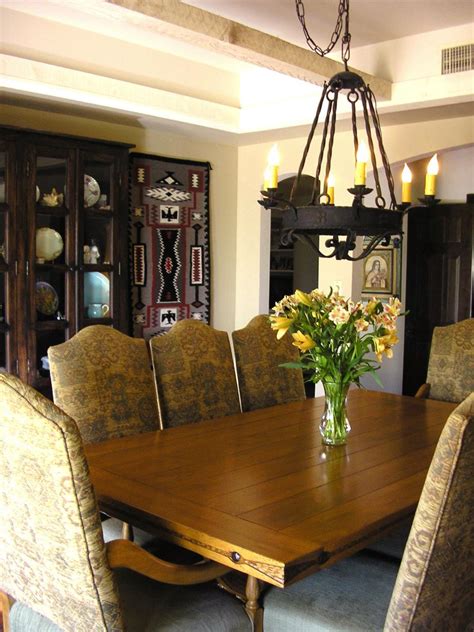 neutral southwestern dining room  iron chandelier hgtv