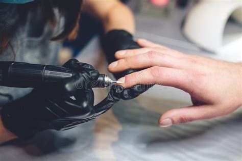 mens manicure professional manicure  man  manicure machine  man receiving  manicure