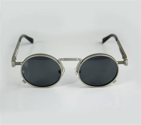 round steampunk sunglasses with spring on temples silver metal frame
