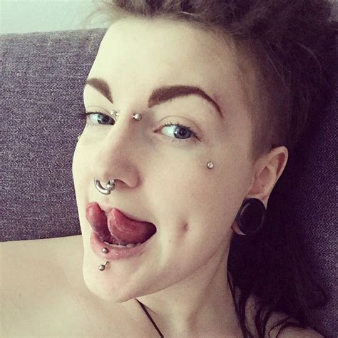 tongue split vertical labret bridge and dermal anchors all done by