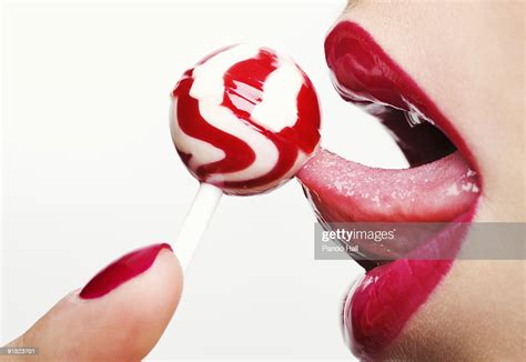 profile of a womans mouth licking lollipop stock foto getty images