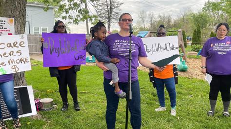 indianapolis child care providers walk   highlight  pay