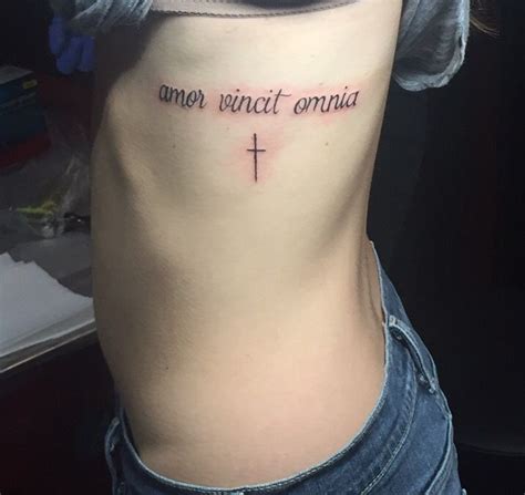 amor vincit omnia love conquers all first tattoo