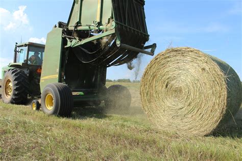 farm  hay bale tractor baler  stock photo public domain pictures