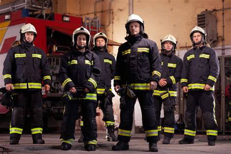 professional firefighters posing  firefighters wearing