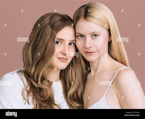 Two Best Friends Close Up Portrait Long Haired Blonde And Brunette Are