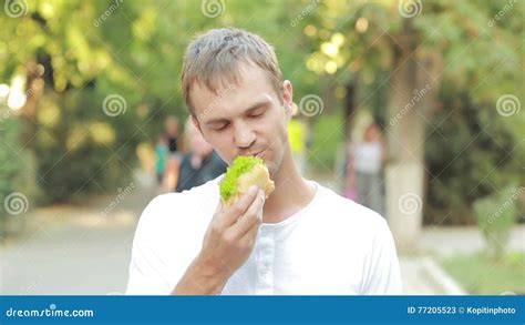 Handsome Man Eating A Sandwich In The Street Stock Video Video Of