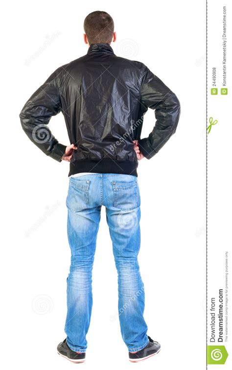 back view of handsome man in jacket looking up stock