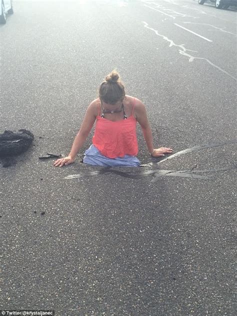 sydney woman climbs into waist deep pothole and live tweets pictures as