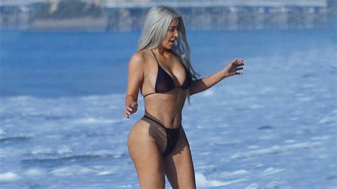 kim kardashian rocks itty bitty butt baring thong bikini on the beach entertainment tonight
