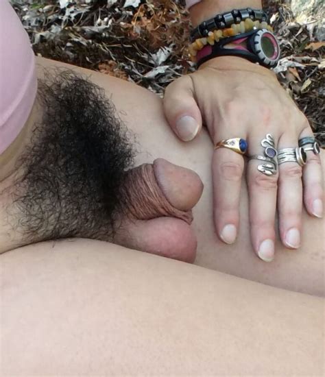 hairy porn pic tiny dick sissy crossdresser shows her hairy bush in the woods