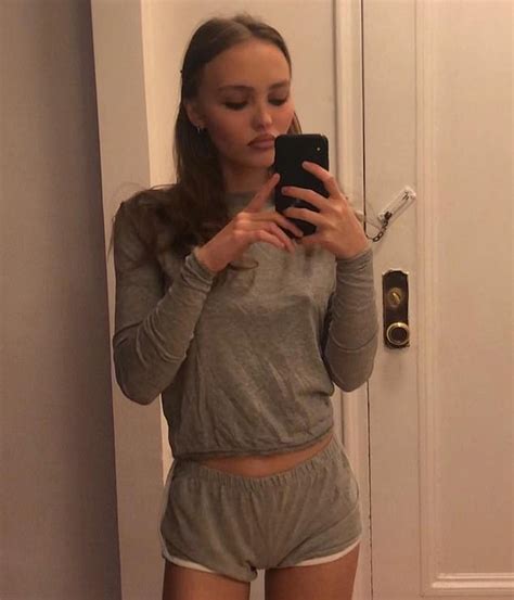 Lily Rose Depp Poses In A Grey Top And Skimpy Shorts For