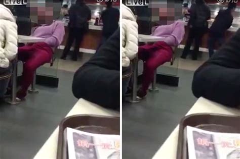 video woman touches groin repeatedly while in mcdonald s