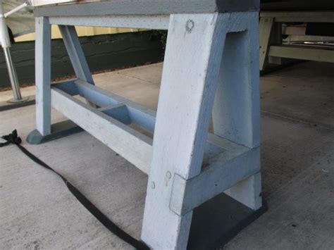 wooden bench sitting  top   cement floor