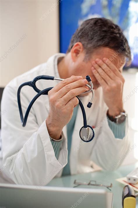 Tired Doctor Stock Image C032 8432 Science Photo Library