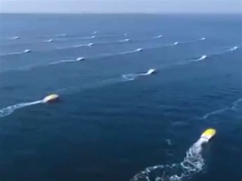 china tests army  tiny drone ships   shark swarm enemies  sea battles