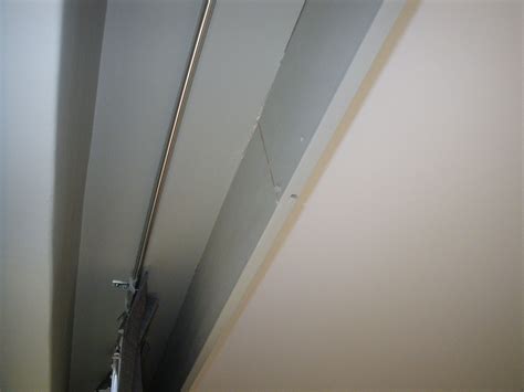 curtains ceiling mounted rail   false bulkhead  cornice ceiling light fixtures living