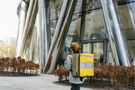 person carrying  bag walking  stock photo