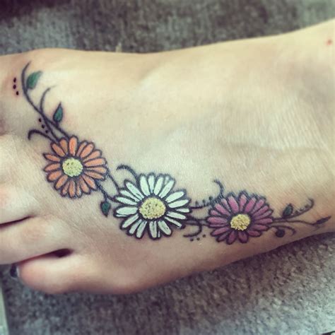 colorful daisy tattoo on foot foot tattoos daisy