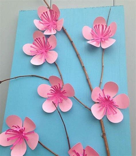 activite manuelle printemps maternelle une branche darbre decoree de petites fleurs rose en