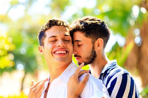 Young Same Sex Couple In Love Outdoors Together Showing All Of Feels