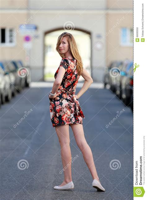 Beautiful Blonde Woman In A Colorful Summer Dress Stock