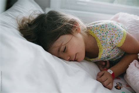 young girl sleeping  bed  stocksy contributor maria manco stocksy