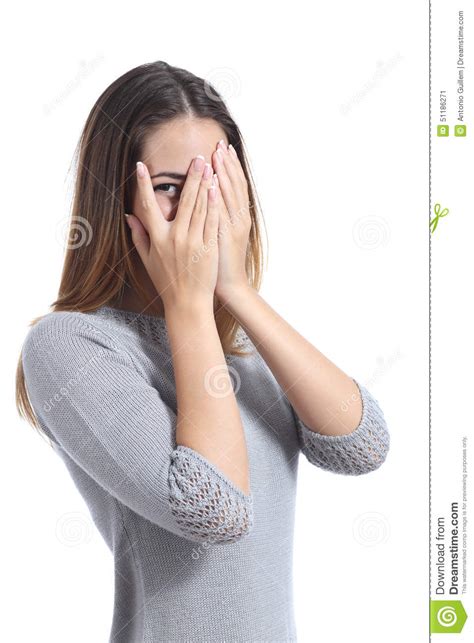 Embarrassed Woman Looking Through Her Hands Covering Her Face Stock