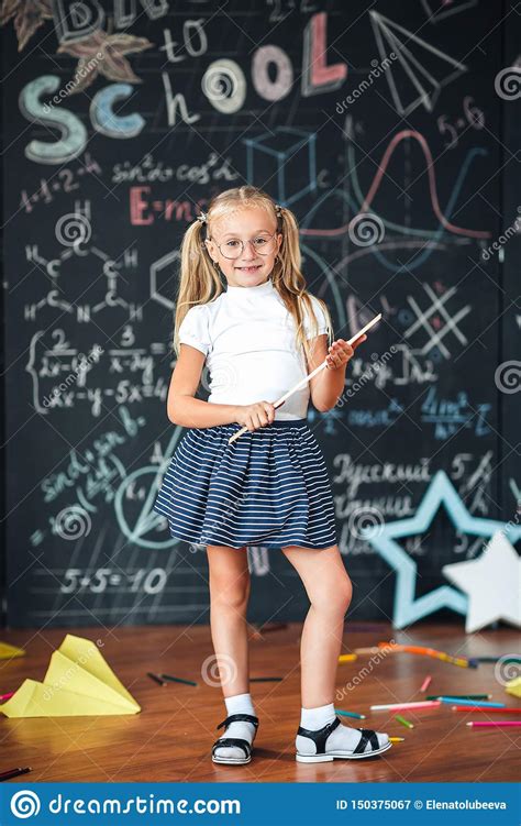 Full Length Portrait Schoolgirl With Glasses And Ruler