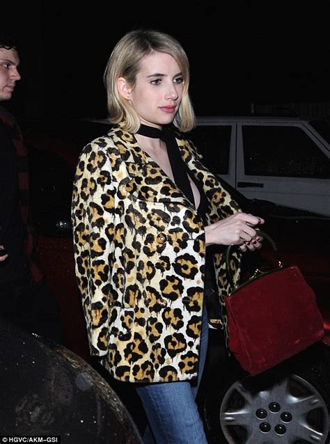 emma roberts flashes her chest in plunging top paired with
