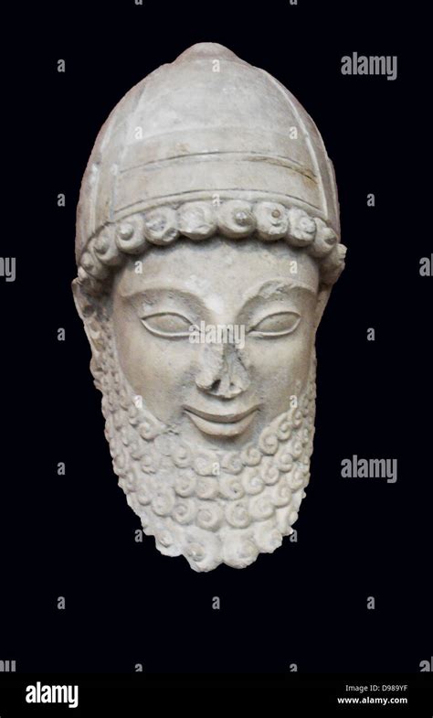 limestone head from a statue of a worshipper wearing a helmet with