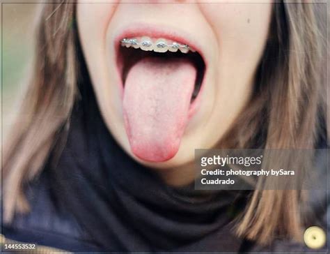 Girl Shows Tongue Photos And Premium High Res Pictures Getty Images