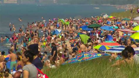 photos show plenty of people flocked to beaches but not a lot of