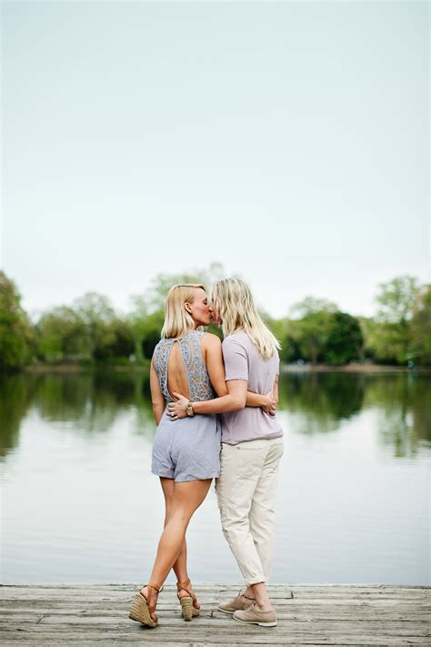 lesbian engagement photos on the lake loving the outfits and natural setting great engagement