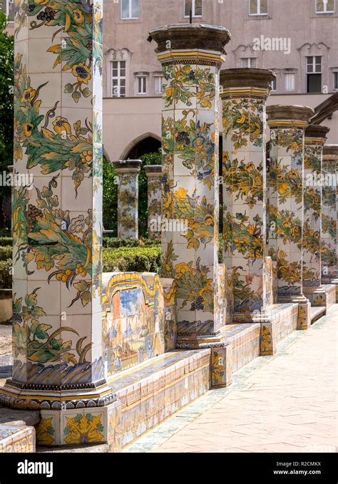 colorful tiled pillars and bench in the cloister garden at the santa