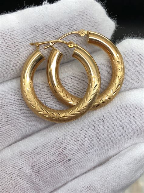 great condition  gold hoops mm wide mm thick