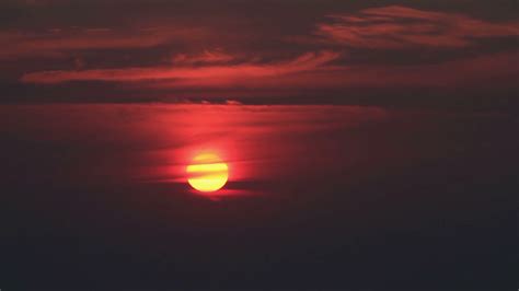 sun rising  dark clouds stock footage sbv  storyblocks